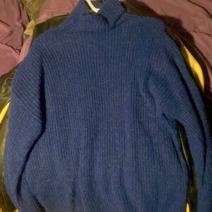 very long knitted turtleneck sweater